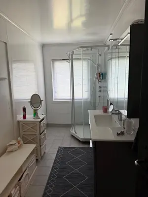a bathroom with a shower and a sink at Fossen bratte chalet in Eikedalen