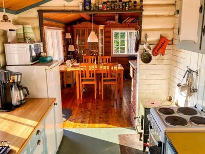 a kitchen with a table and a dining room at 6 person holiday home in LEKSVIK in Leksvik