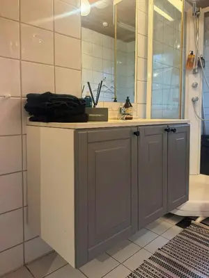 a bathroom with a sink and a mirror at Cosy Family Cabin With Views And Sauna in Svingvoll