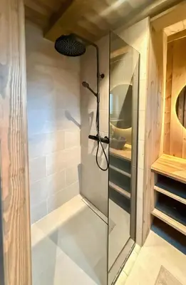 a shower with a glass door in a bathroom at Modern Family Cabin Near Kikut In Geilo in Geilo