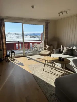 a living room with a couch and a table at Beautiful apartment at Ustaoset in Hol