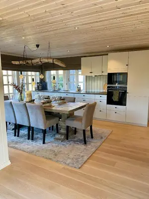a kitchen with a dining room table and chairs at Bjarnebu - 4 bedroom cabin in Rauland in Rauland