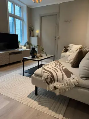 a living room with a couch and a table at The best place to stay in city center - close to everything in Bergen