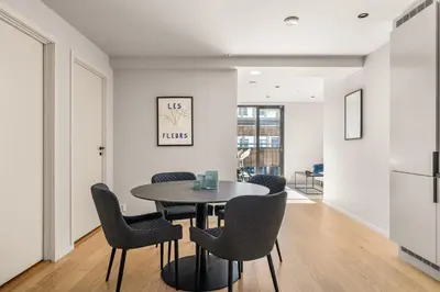 a dining room with a table and chairs at Downtown Modern Apartment - Two Bedrooms! in Bergen