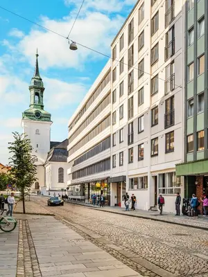 a city street with a building and a clock tower at Downtown Modern Apartment - Two Bedrooms! in Bergen