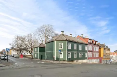 a group of buildings on the side of a street at Koselig leilighet ved Solsiden in Trondheim