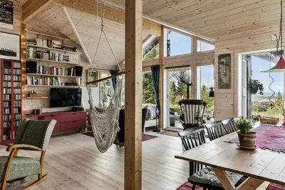 a living room with a hammock in a house at Family Cabin With Views Over Hadeland in Lunner
