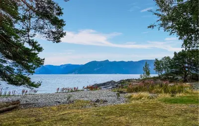 a view of a lake with mountains in the background at Gorgeous Home In Lavik With House Sea View in Lavik