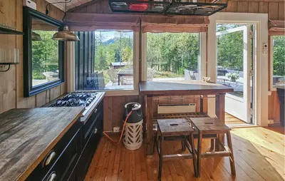 a kitchen with a counter and a stove top oven at 2 Bedroom Nice Home In Noresund in Noresund