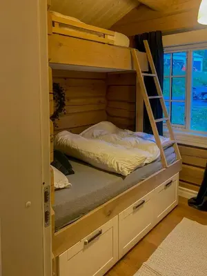 a bunk bed in a tiny house at Log Cabin With Panoramic Views At Voss Resort in Skulestadmo