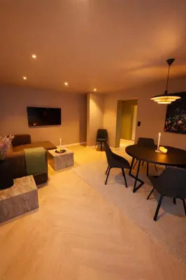 a living room with a couch and a table at Trolltunga Stay in Odda