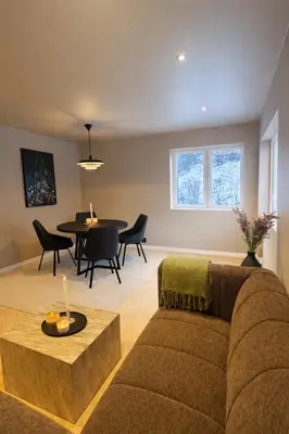 a living room with a couch and a table at Trolltunga Stay in Odda
