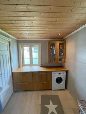 a laundry room with a washer and dryer at House with oceanview in Stryn