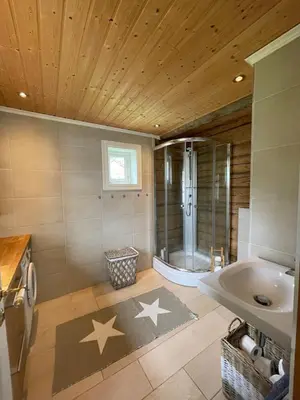 a bathroom with a shower and a sink at House with oceanview in Stryn