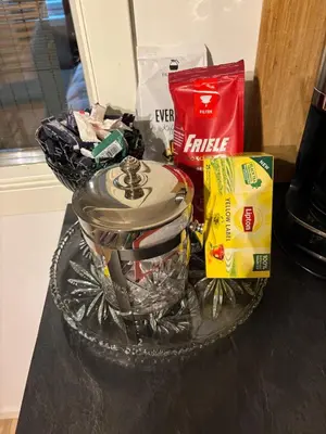 a basket of food and snacks on a table at 3 soveroms leilighet-komfort og stil -perfekt for ferie og jobb in Gjøvik
