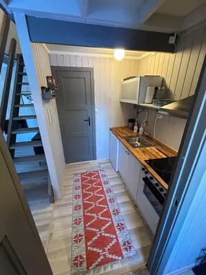 a small kitchen with a sink and a stove at Nice apartment at Golsfjellet in Gol