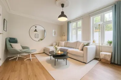 a living room with a couch and a table at Apartment Bergen Center - Quiet Gem - Norwegians Minimum Age 25 in Bergen