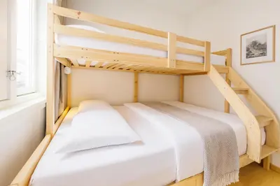 a bedroom with two bunk beds in a room at Quartet Bryggen Central - Quiet and Cozy - Norwegians Minimum Age 25 in Bergen