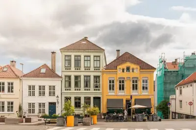 a group of colorful buildings in a city at Cozy loft with king bed in the middle of town in Bergen