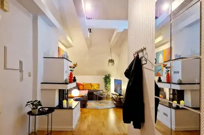 a large living room with a couch and a table at King bed Great location Top floor in Bergen