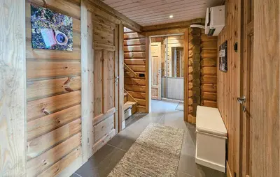 a hallway in a log cabin with wooden walls at Nice Home In Gol With Sauna in Gol