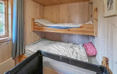 a small room with two bunk beds in it at 4 Bedroom Lovely Home In Nord-Torpa - N31585 in Nord Torpa