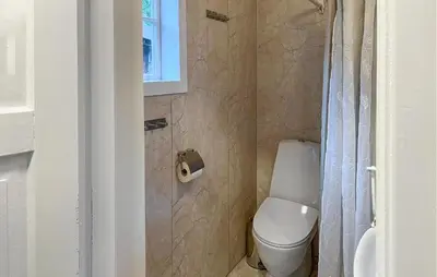a small bathroom with a toilet and a window at Gorgeous Home In Eikesdal - N28170 in Verma
