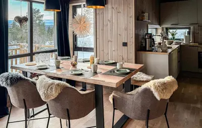 a dining room with a wooden table and chairs at 2 Bedroom Beautiful Home In Gålå in Gålå