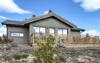 a house with a large deck on the side of it at 2 Bedroom Beautiful Home In Gålå in Gålå