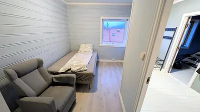 a small room with a couch and a table at 2 Bedroom central apartment in Bergen