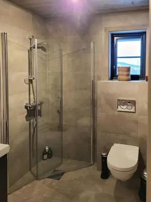 a bathroom with a shower and a toilet at Modern Cabin In Norefjell With Sauna in Noresund