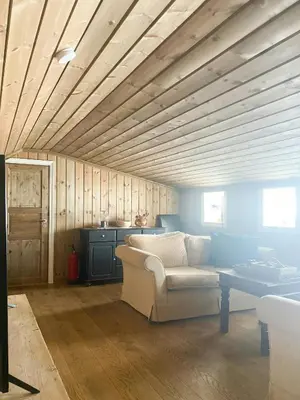 a living room with a couch and a table at Family Cabin By The Ski Trails In Rauland in Seljord