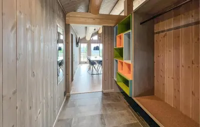 a hallway of a house with wooden walls at Lovely Home In Gålå With Sauna in Gålå
