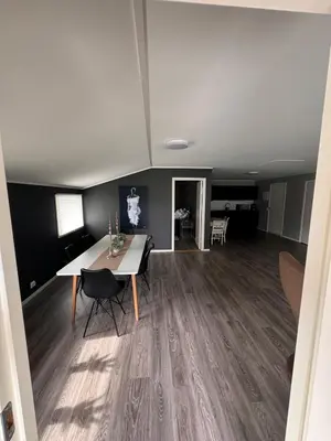 a living room with a table and a dining room at Steinkjer, 5 room apartment in Steinkjer
