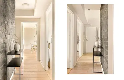 a hallway with white walls and a stone wall at Solheimslien in Bergen