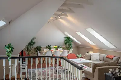a living room with a couch and a table at Big, Bright & Beautiful - with 6 Large Bedrooms in Bergen
