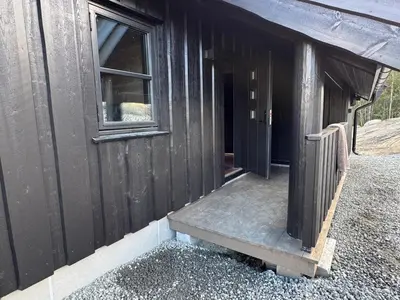 an open door of a building with a window at Elegantes, ruhiges Ferienhaus in bester Lage für alle Outdoorfans in Randsverk