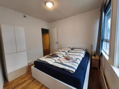 a bedroom with a large bed in a room at Modern 3-Bedroom Apartment in Central Voss - Prime Location in Vossevangen