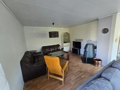a living room with a couch and a table at Brendefur Panorama in Hornindal