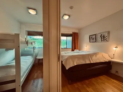 a bedroom with a bunk bed and a window at Central Apartment in Geilo in Geilo