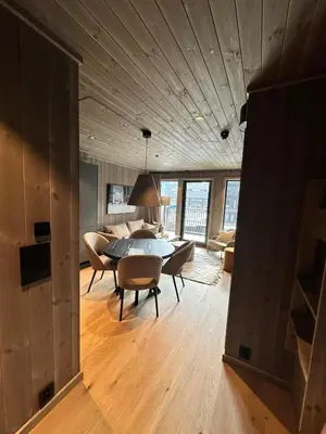 a dining room with a table and chairs in a room at New apartment in Hemsedal Fjellandsbyen in Hemsedal