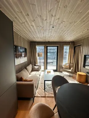 a living room with a couch and a table at New apartment in Hemsedal Fjellandsbyen in Hemsedal