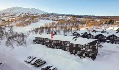 an aerial view of a resort in the snow at Hovden Alpin Apartments in Bykle