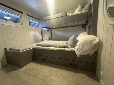 a small bedroom with a bunk bed in a house at Hovden Alpin Apartments in Bykle