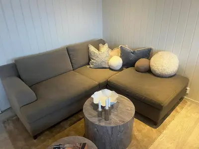 a living room with a couch and a table at Hovden Alpin Apartments in Bykle