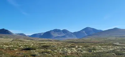 a view of the mountains in the distance at Kvamsfjellet - Rondane in Nord-Fron