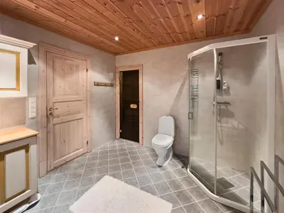 a bathroom with a shower and a toilet at Mountain cabin in Aurdal Fireplace Sauna 1000 meters above sea level in Aurdal