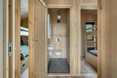 a small room with a toilet and bunk beds at Mountain Cabin With Panoramic Views In Norefjell in Noresund