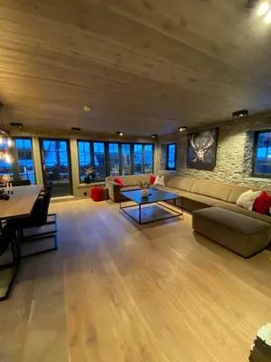 a large living room with a couch and a table at Hovden Alpin Lodge Appartement in Bykle