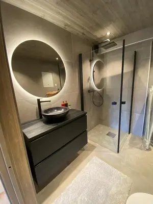 a bathroom with a sink and a mirror at Hovden Alpin Lodge Appartement in Bykle